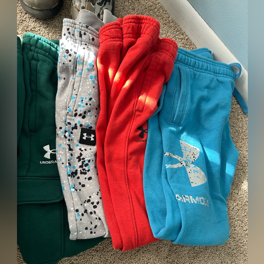 4 pairs of under armour pants, if worn, maybe once. One NWT… YL